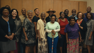 Clotilda descendants and community activists pose for a group photo in the documentary Descendant.